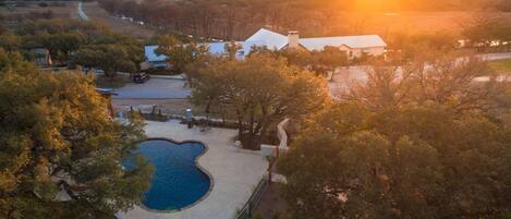 Outdoor pool, open 10:00 AM to 10:00 PM, pool loungers