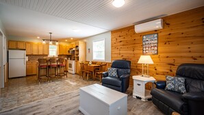 A compact living space with a kitchen, dining area, and seating area. - Beach, Golf, Relax & Enjoy Our Beautiful Stanhope, PEI Cottage for your vacation (Stanhope)