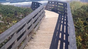 A wooden boardwalk leading to a beach with ocean views. - Beach, Golf, Relax & Enjoy Our Beautiful Stanhope, PEI Cottage for your vacation (Stanhope)