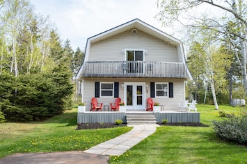 Enjoy the southern exposure deck on the Adirondack chairs and bench