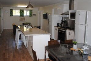 House, 4 Bedrooms (Lorikeet Lodge) | Private kitchen | Fridge, microwave, stovetop, coffee/tea maker