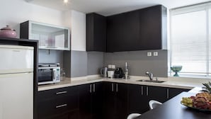 Classic Apartment, 2 Bedrooms, Terrace | Private kitchenette | Coffee/tea maker, full-size fridge, microwave, oven - Holyguest - Adam Hacohen (Tel Aviv)