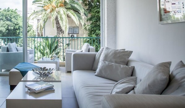 Classic Apartment, 2 Bedrooms, Terrace | Living area | TV - Holyguest - Adam Hacohen (Tel Aviv)
