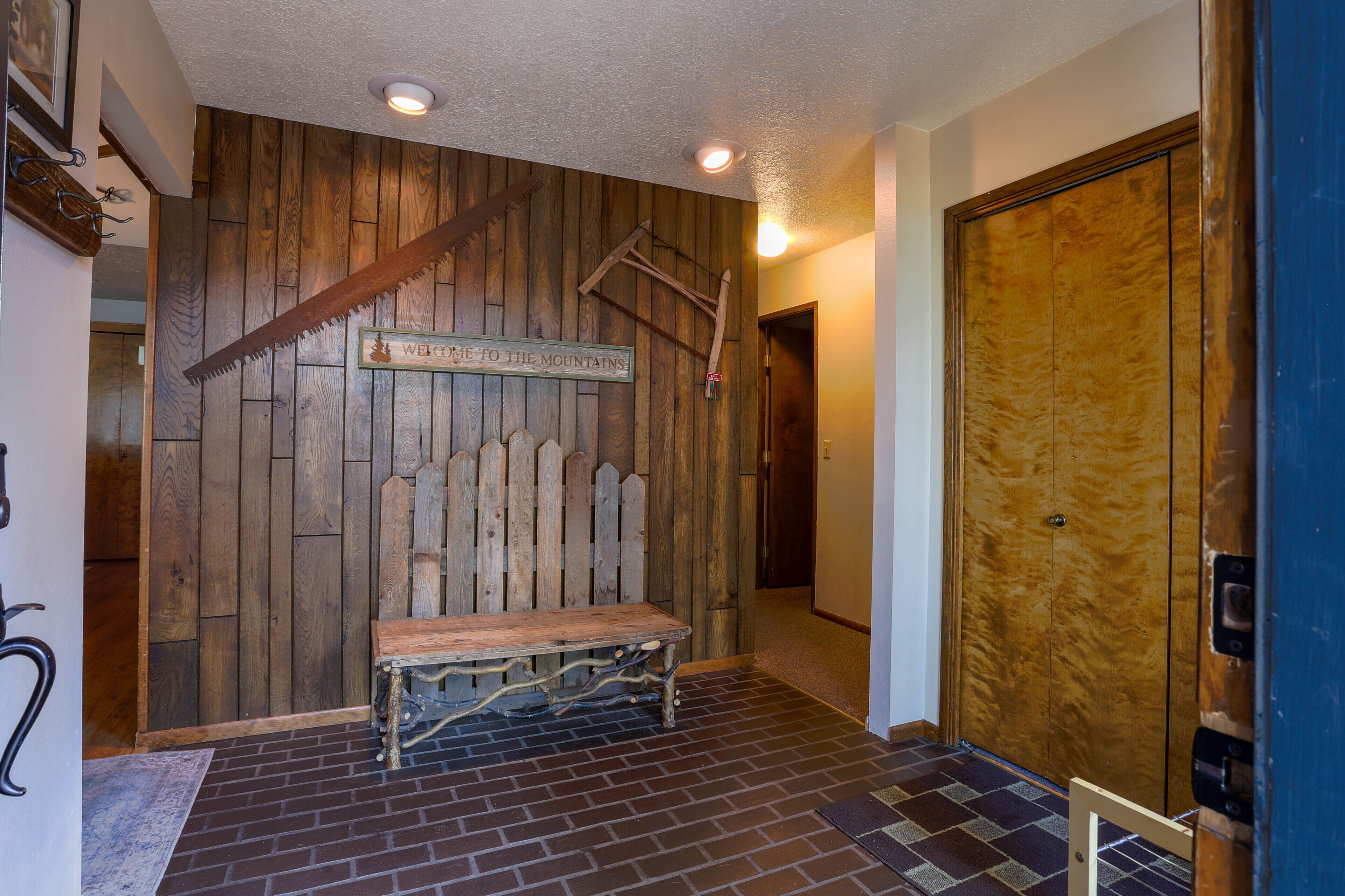 Large entry with coat closet and bench