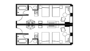 A floor plan of a hotel room with a bathroom, a desk, a bed, and a small seating area.