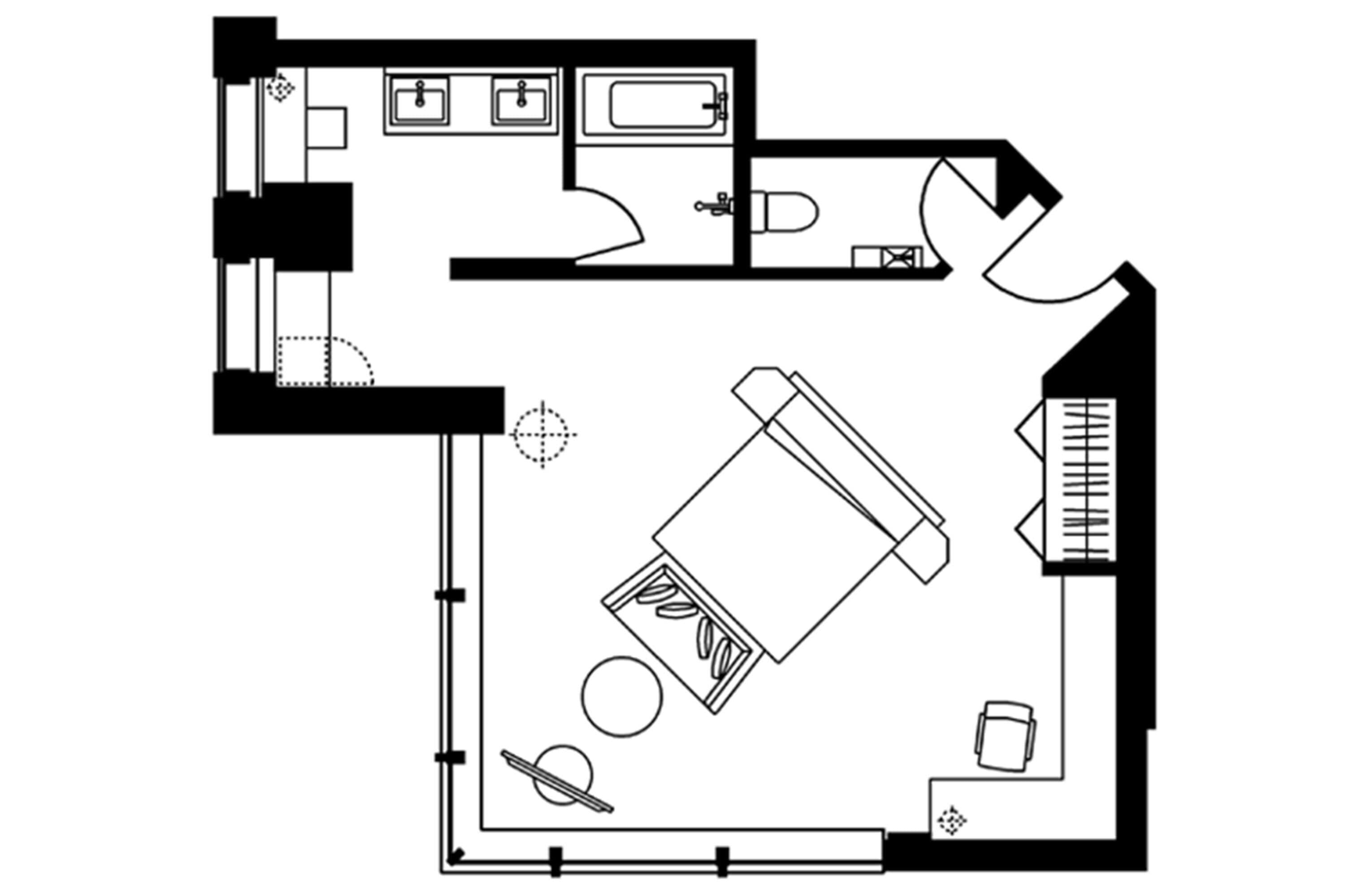 Planta baixa de um quarto de hotel com cozinha compacta, banheiro, cama e escrivaninha.