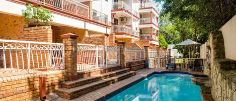 Outdoor pool, pool umbrellas, pool loungers