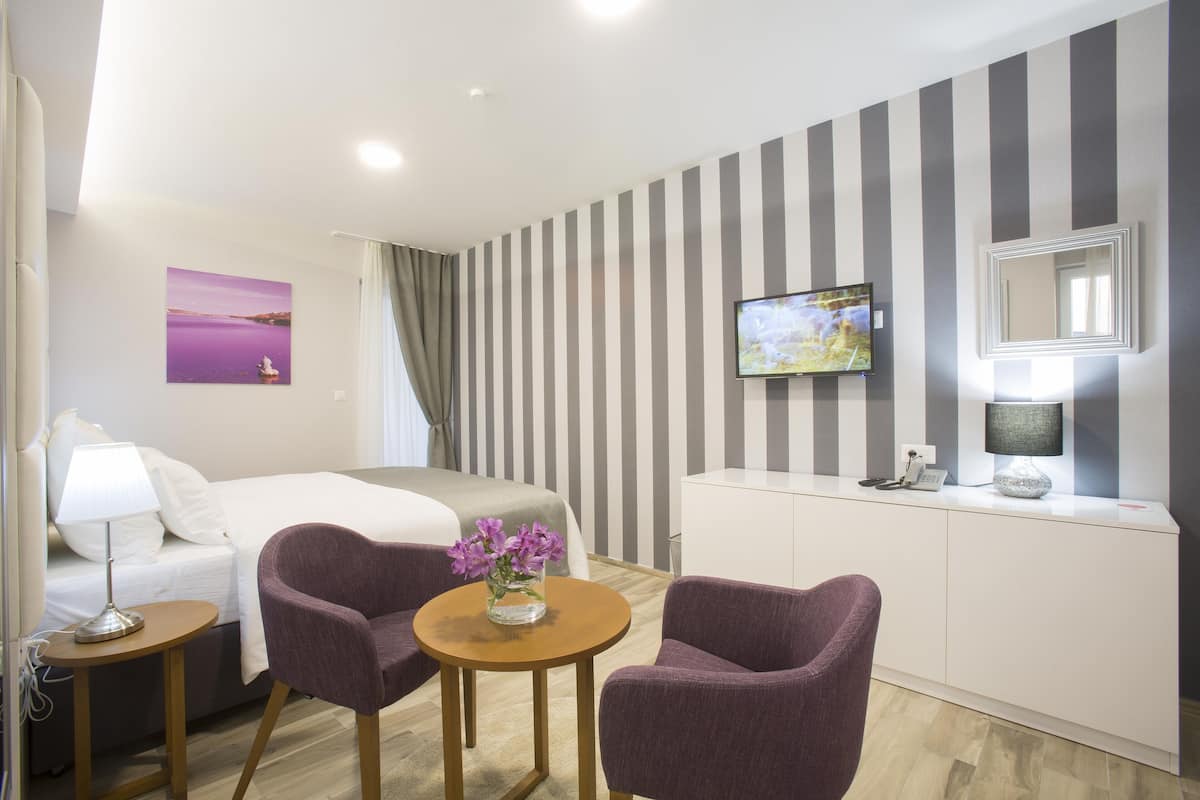Premium bedding, down duvets, Select Comfort beds, minibar