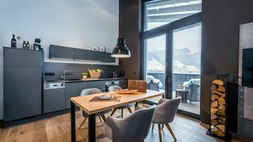 Luxury Suite, 1 Bedroom, Sauna, Resort View | Private kitchen | Fridge, stovetop, dishwasher, espresso maker