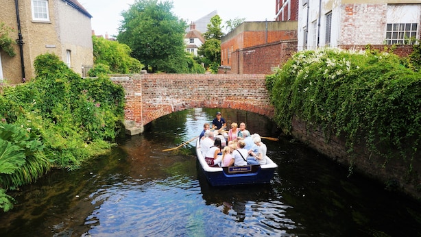 A narrow canal with a boat carrying passengers. - Greyfriars Lodge (Canterbury)