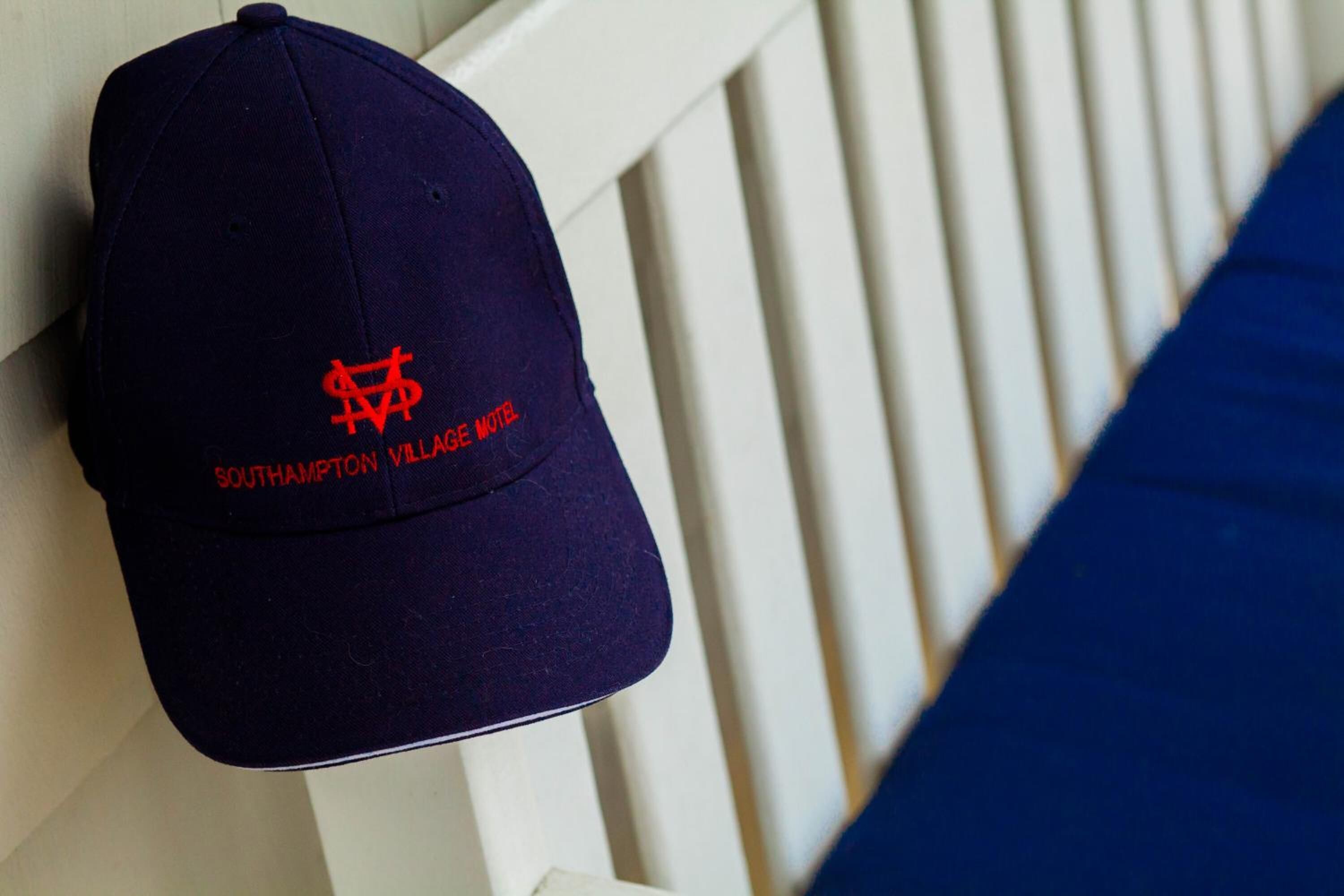A navy blue cap with a red logo and text reading "Southampton Village Motel."