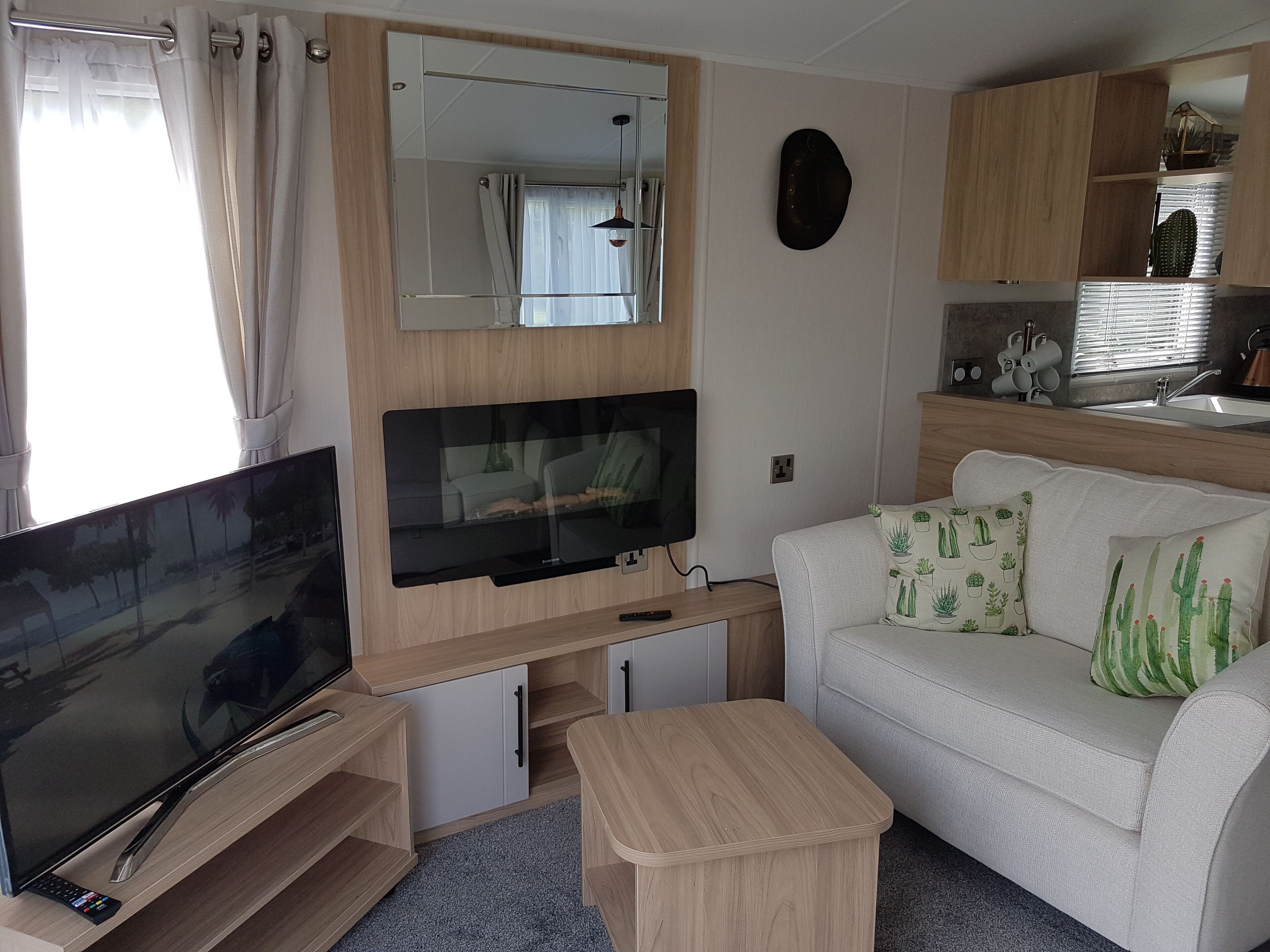 Deluxe Mobile Home | Living area | 32-inch flat-screen TV with digital channels, TV