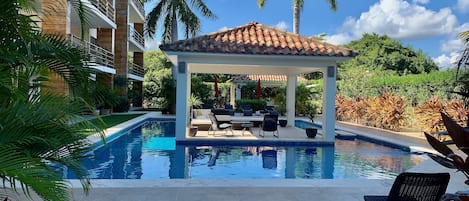 Outdoor pool, pool umbrellas, sun loungers