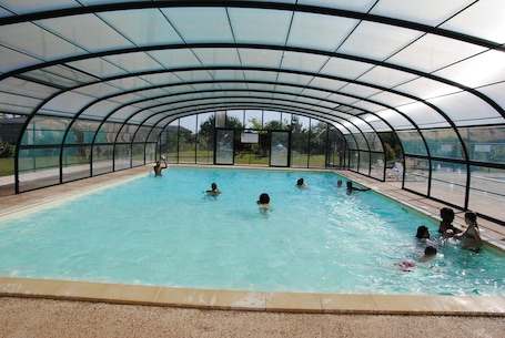 Indoor pool, a heated pool. Large furnished cottage with covered terrace and parking space