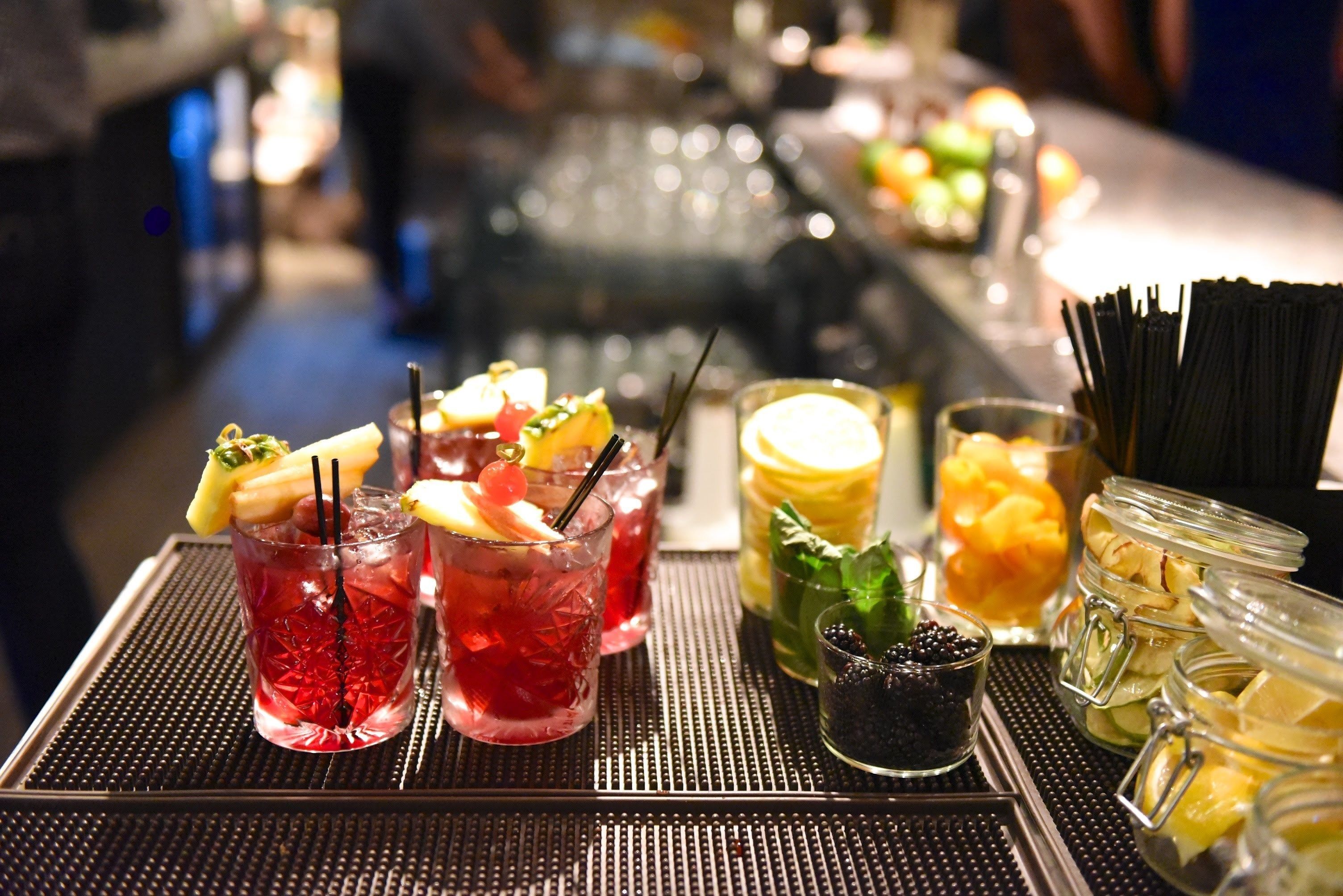 A bar area with various drinks and snacks.