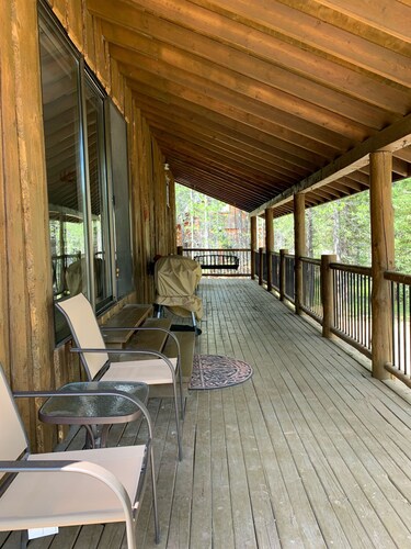 Porch lined cabin nestled in the Pines for lazy summer days
