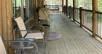 Porch lined cabin nestled in the Pines for lazy summer days