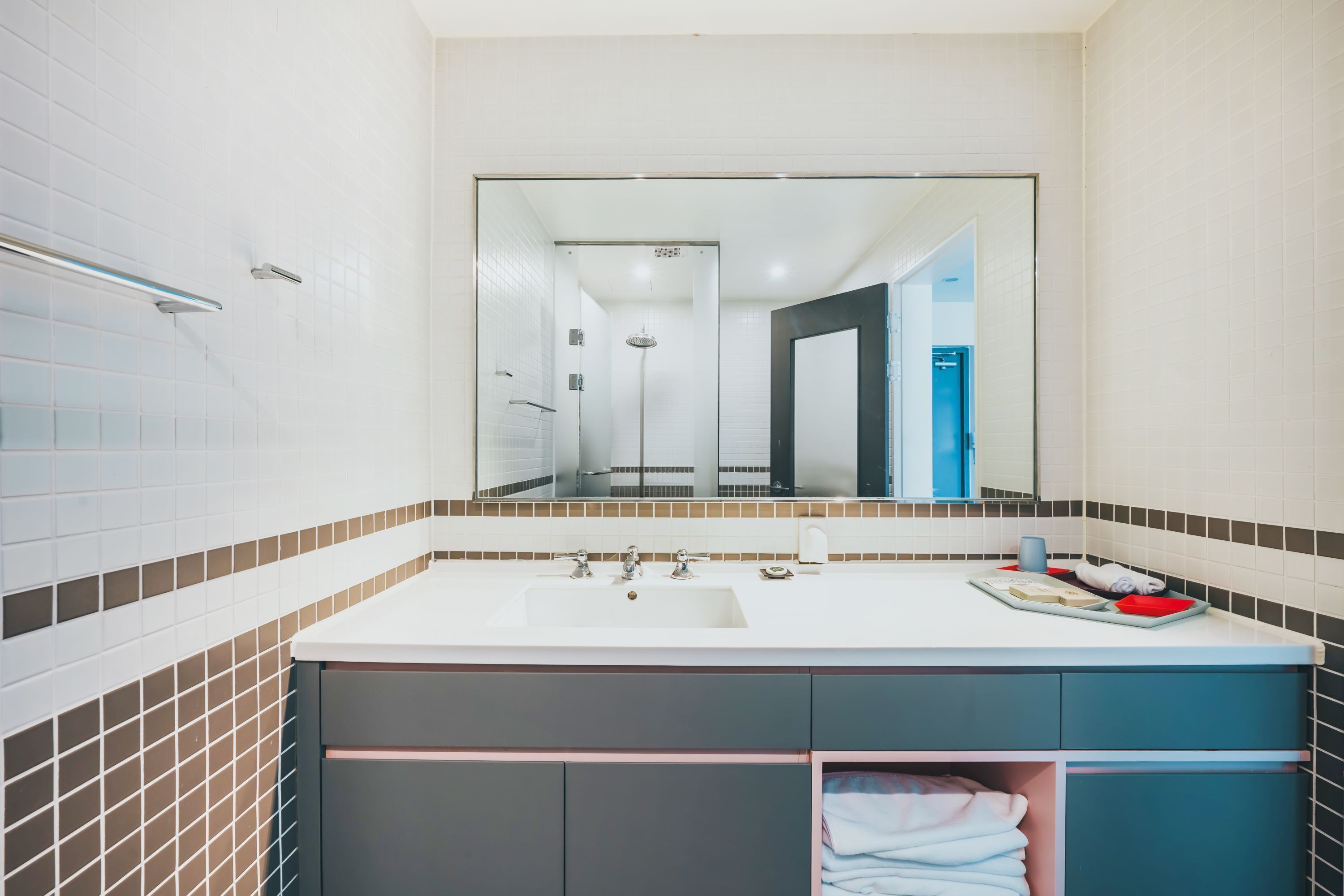 designer toiletries, hair dryer, bathrobes, slippers