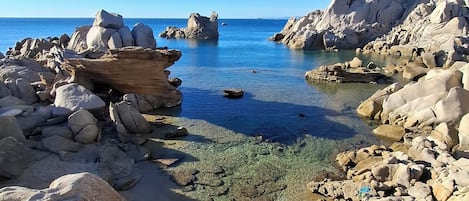 On the beach, sun-loungers