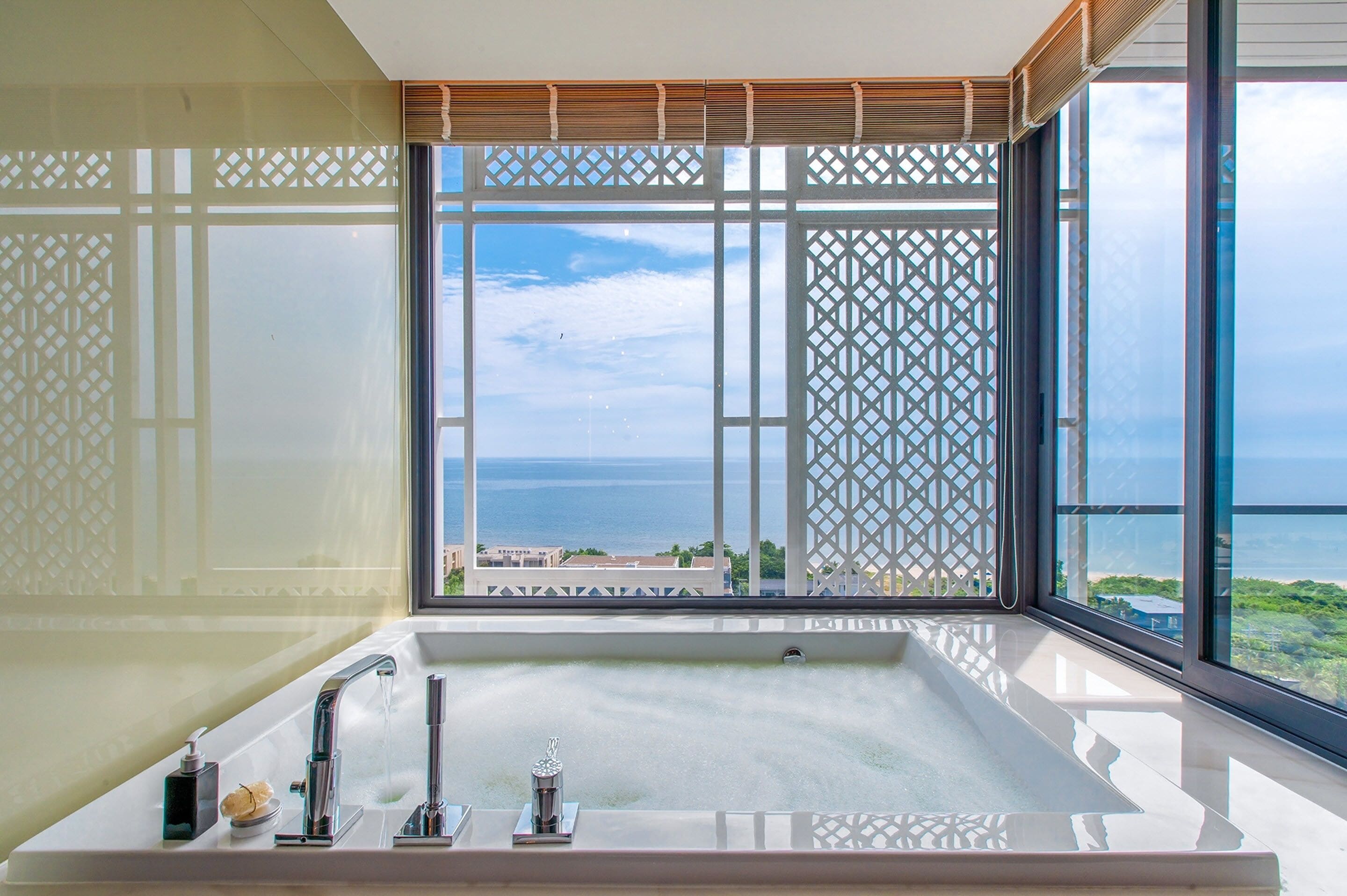 baba grand ocean suite corner | bathroom | separate bathtub and shower, rainfall showerhead, designer toiletries
