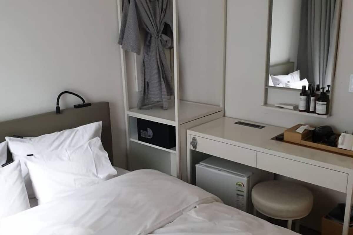 Desk, blackout curtains, soundproofing, iron/ironing board