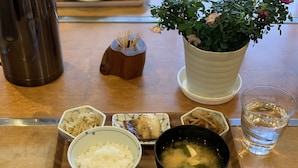 A tray with various dishes including rice, soup, and pickled vegetables. - Yakushima Guesthouse Suginoko (Yakushima)