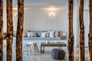 Family Condo | Living area | 27-inch flat-screen TV with satellite channels, TV, DVD player - Cosmopolis Crete Suites (Hersonissos)