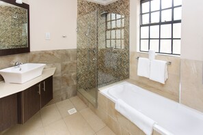 Separate tub and shower, deep soaking tub, rainfall showerhead