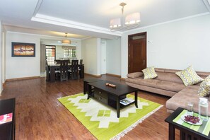 Executive Apartment, 2 Bedrooms (With an office) | Living area | Flat-screen TV - Cozy Residences (Nairobi)