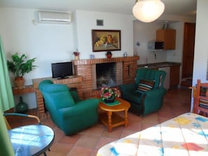 Superior Studio, Jetted Tub | Living room | Flat-screen TV
