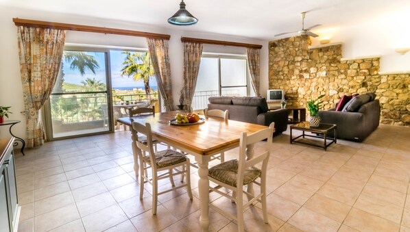 Standard Apartment, 2 Bedrooms, Pool Access | Living area | Flat-screen TV