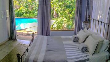 Superior Double Room, 1 Queen Bed, Pool View | Premium bedding, individually decorated, individually furnished, desk
