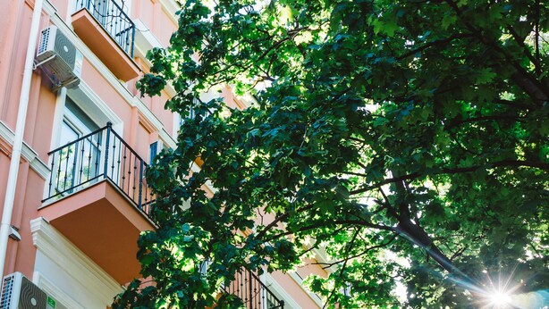 A multi-story building with balconies, large windows, and air conditioning units. - Potemkinn Hotel (Odesa)