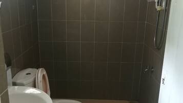 Standard Quadruple Room, 2 Double Beds | Bathroom | Shower, free toiletries, hair dryer, bidet