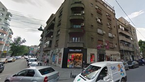 A multi-story building with a storefront named "MELI MEO" on the ground floor. - Casa Mendeleev (Bucharest)
