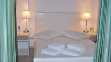 Desk, laptop workspace, free WiFi, bed sheets