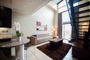 Apartment, 2 Bedrooms, Kitchenette, Courtyard View (With a Loft) | Living room | TV - All Suite on 14th (Randburg)