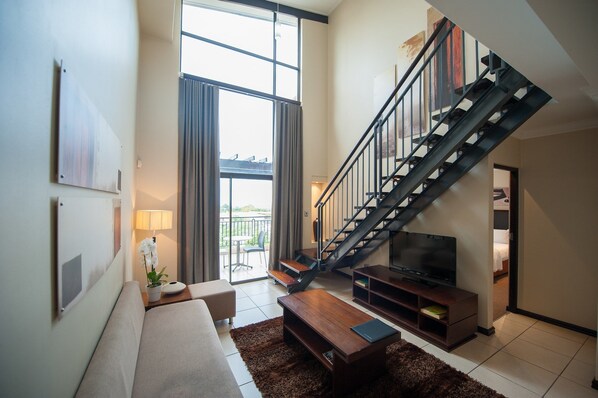 Apartment, 2 Bedrooms, Kitchenette, Courtyard View (With a Loft) | Living room | TV - All Suite on 14th (Randburg)