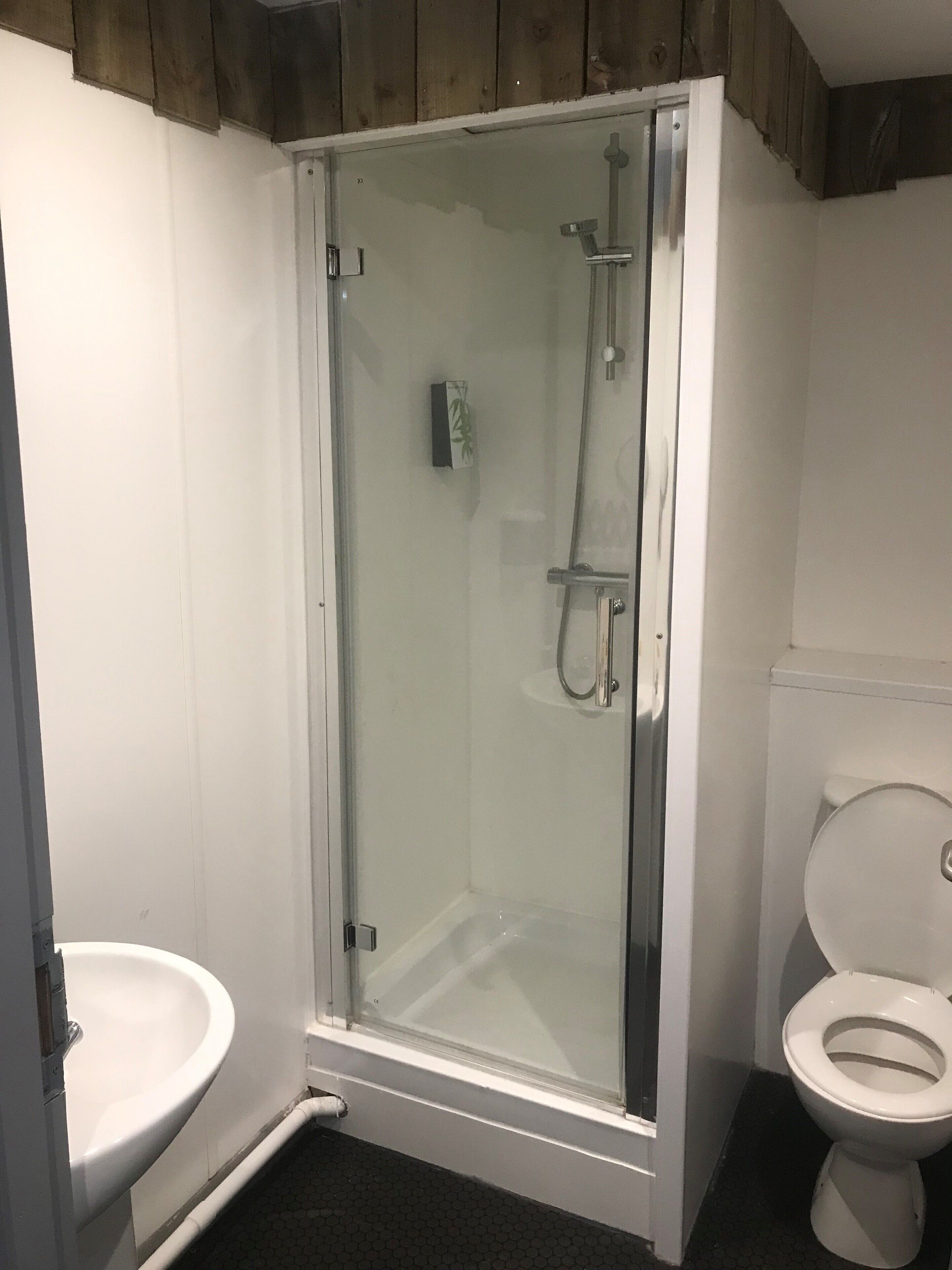 superior studio suite, multiple beds | bathroom | free toiletries, hair dryer, towels