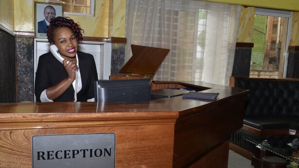 A reception desk with a sign labeled "RECEPTION".