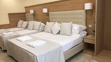 Premium bedding, down comforters, minibar, in-room safe