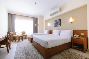 Family Room | Minibar, in-room safe, desk, blackout curtains - The Grand Plaza Hotel Smouha (Alexandria)