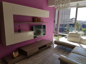 Apartment, 1 Bedroom | Living area | Flat-screen TV, iPod dock