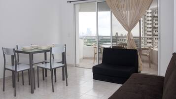 Standard Apartment, 2 Bedrooms | Living area | 32-inch flat-screen TV with cable channels, TV