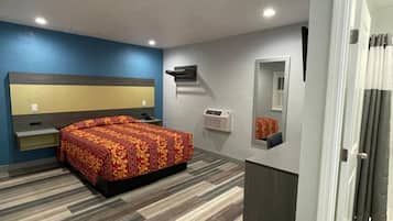 Tabla de planchar con plancha, wifi gratis y ropa de cama