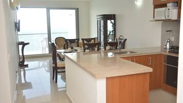 Superior Apartment, 2 Bedrooms, Ocean View | Private kitchen | Full-sized fridge, microwave, oven, stovetop