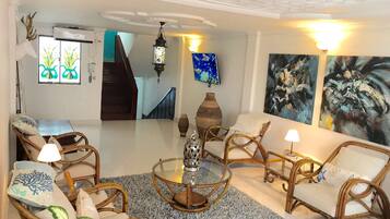 Luxury Apartment, 2 Bedrooms | Living area | 50-inch flat-screen TV with cable channels, TV
