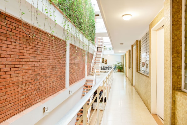 Standard Room, Multiple Beds | Living area | 42-inch TV with cable channels