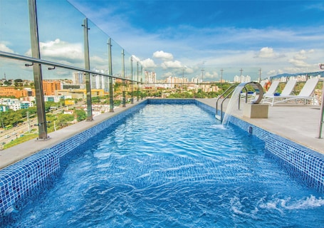 Outdoor pool, open 10 AM to 6:30 PM, pool umbrellas, sun loungers