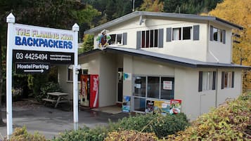 Stay in a simple, functional room at The Flaming Kiwi Backpackers.